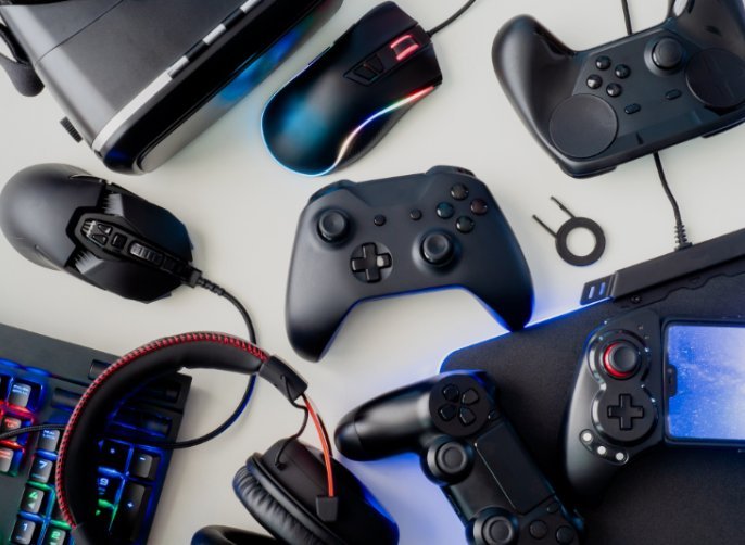 Gaming peripherals flat lay including mice, keyboard and controllers